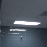 Washable vinyl coated ceiling tile in industrial shower
